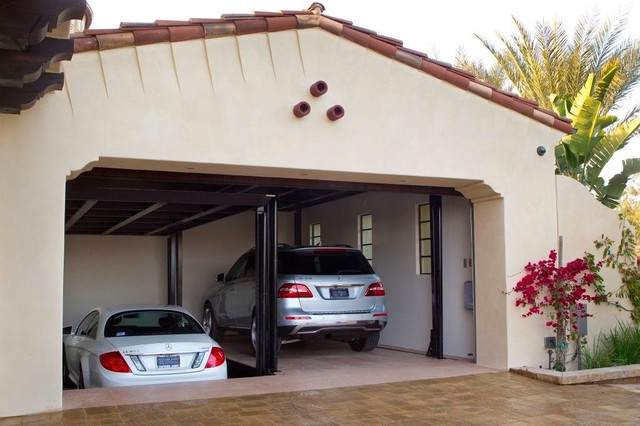 Custom car lift in California garage - Mediterranean 