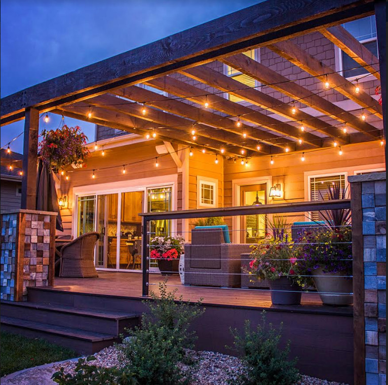 Deck - mid-sized transitional backyard deck idea in Denver with a pergola