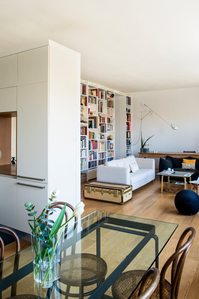 Example of a huge trendy loft-style light wood floor family room design in Rome with white walls