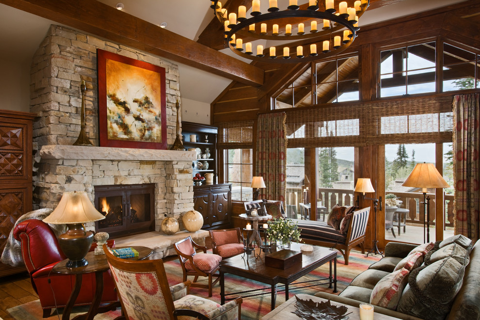 This is an example of a traditional living room in Salt Lake City with a standard fireplace, a stone fireplace surround and no tv.