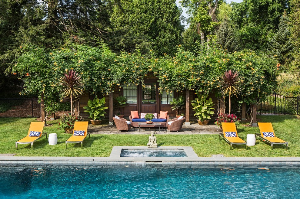 Inspiration for a transitional pool in New York with a pool house and concrete slab.