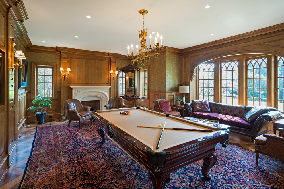 Large traditional enclosed family room in Philadelphia with a game room, brown walls, linoleum floors, a standard fireplace, a plaster fireplace surround and no tv.