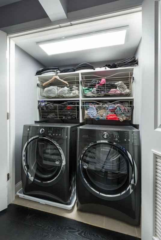 Design ideas for a small contemporary laundry cupboard in Chicago with open cabinets, white cabinets, grey walls, ceramic floors and a side-by-side washer and dryer.