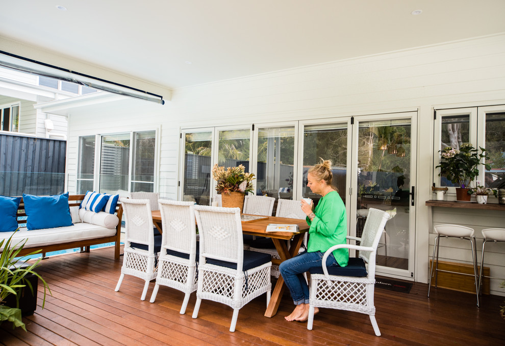 Inspiration for a mid-sized beach style backyard patio in Sydney with decking.
