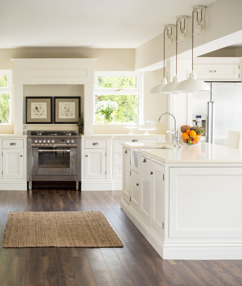 Design ideas for a traditional kitchen in Dublin with beaded inset cabinets, white cabinets and with island.