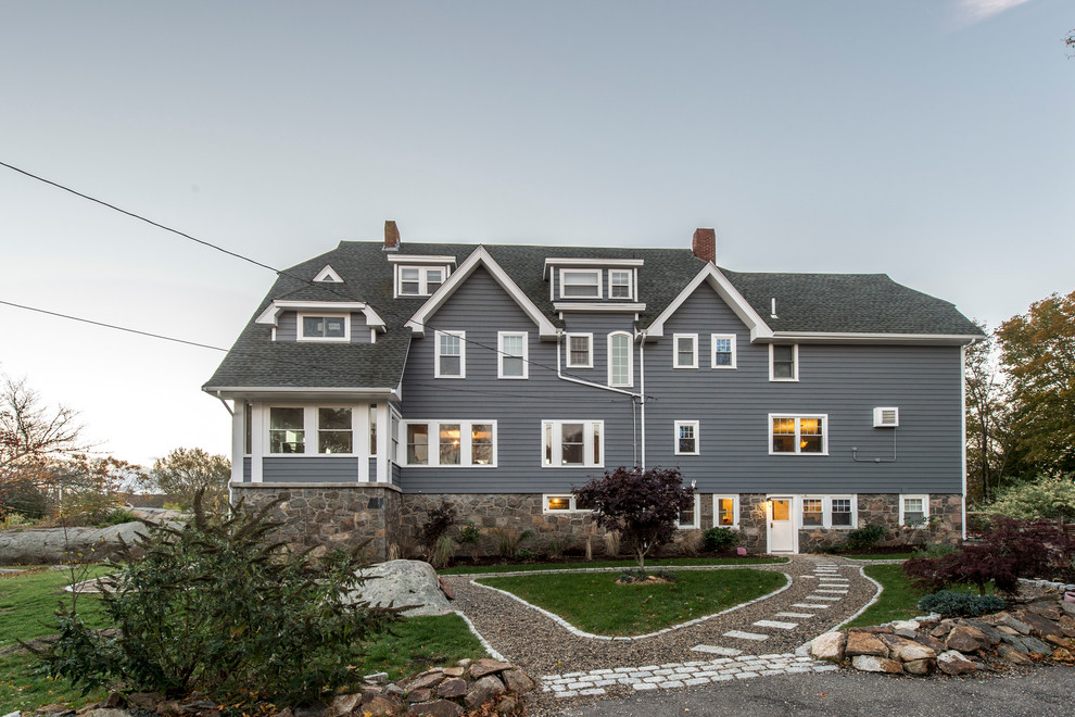 Inspiration for a large traditional three-storey grey house exterior in Boston with a shingle roof, mixed siding and a gambrel roof.