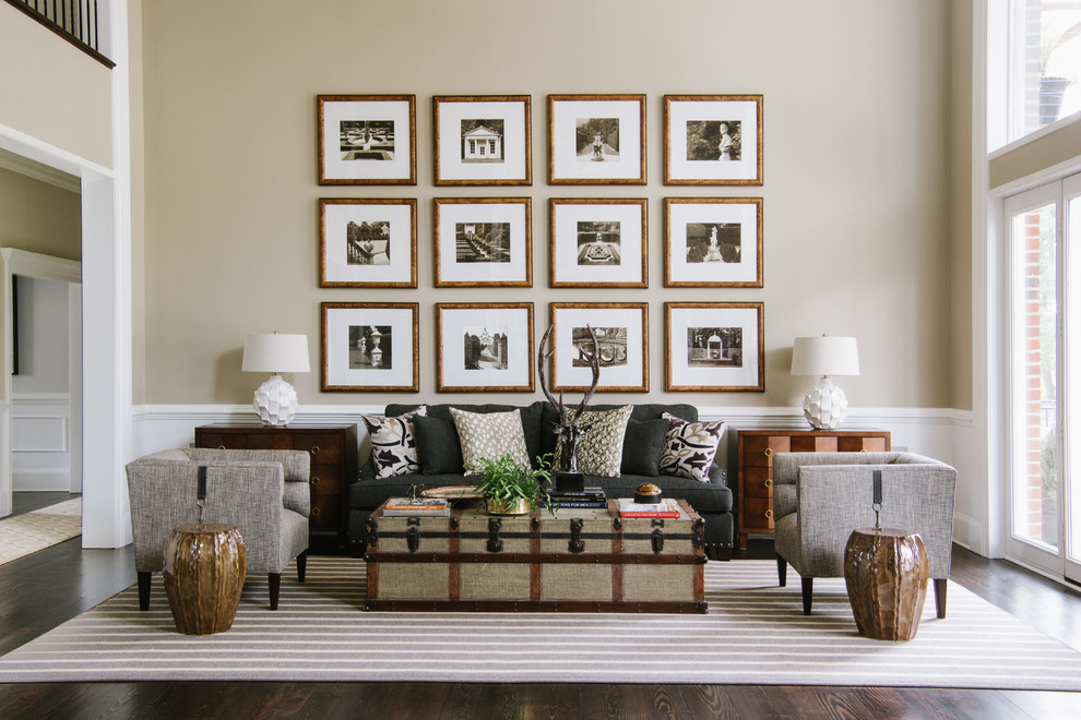 Example of a classic formal dark wood floor living room design in DC Metro with beige walls and no fireplace