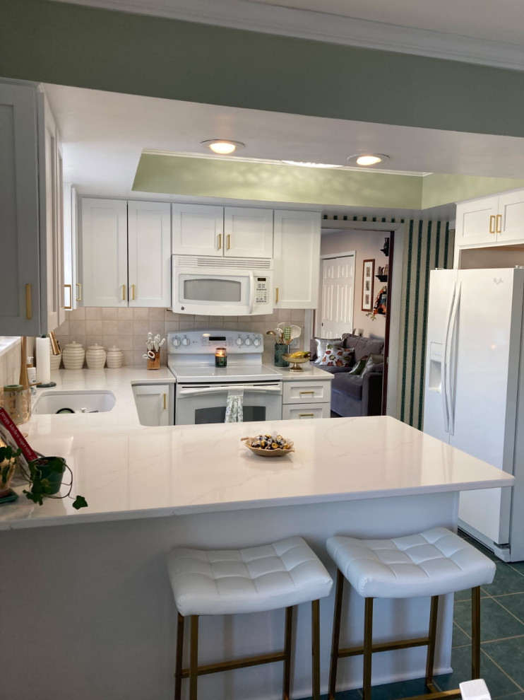 Enclosed kitchen - mid-sized transitional u-shaped enclosed kitchen idea with shaker cabinets, white cabinets and quartz countertops