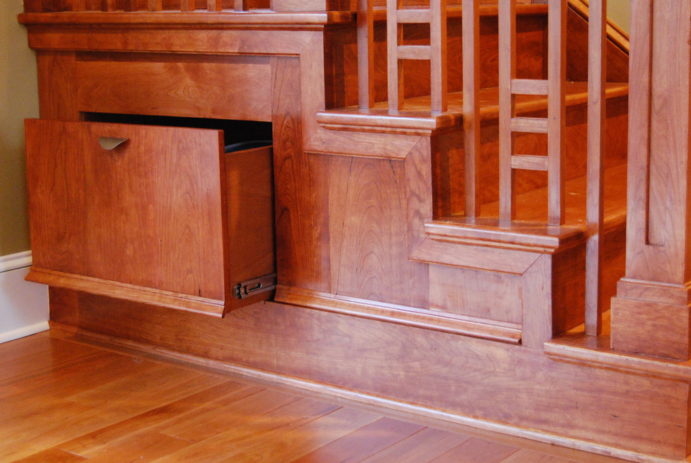 Small traditional wood u-shaped staircase in Philadelphia with wood risers.