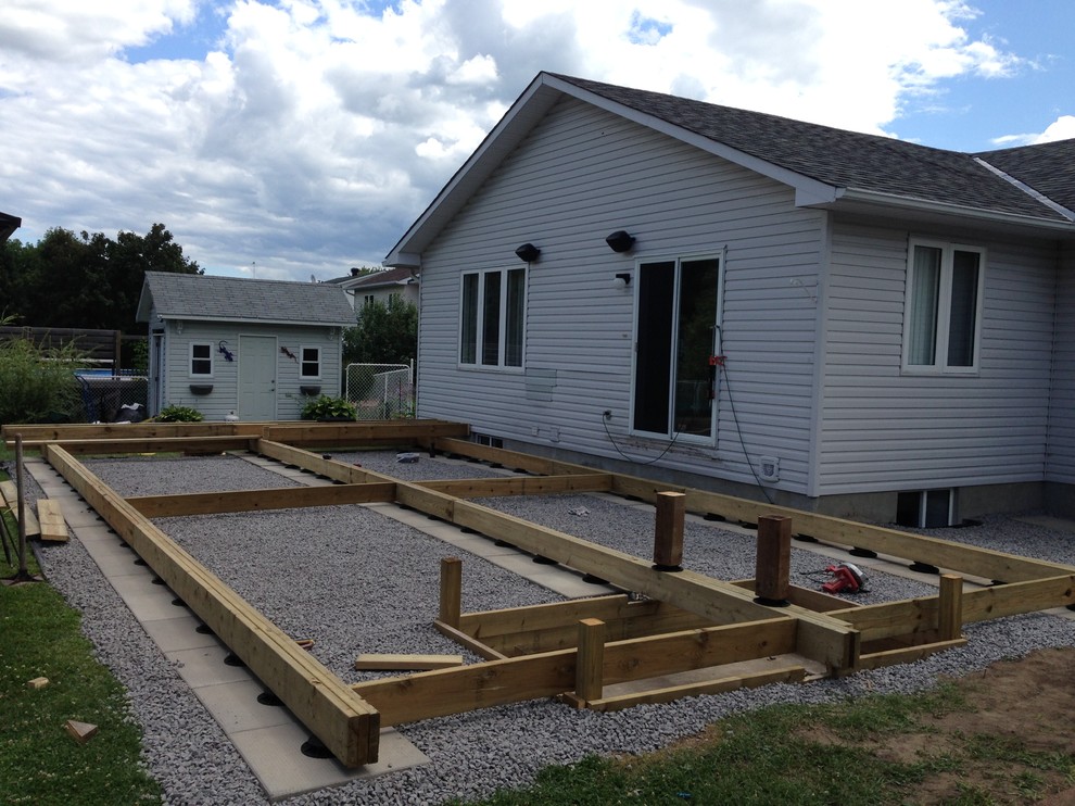 Example of a huge transitional backyard deck design