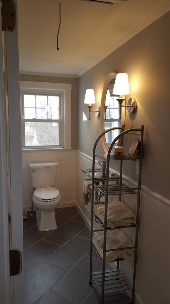 Small transitional 3/4 bathroom in Boston with open cabinets, a two-piece toilet, gray tile, porcelain tile, grey walls, porcelain floors, a wall-mount sink and glass benchtops.
