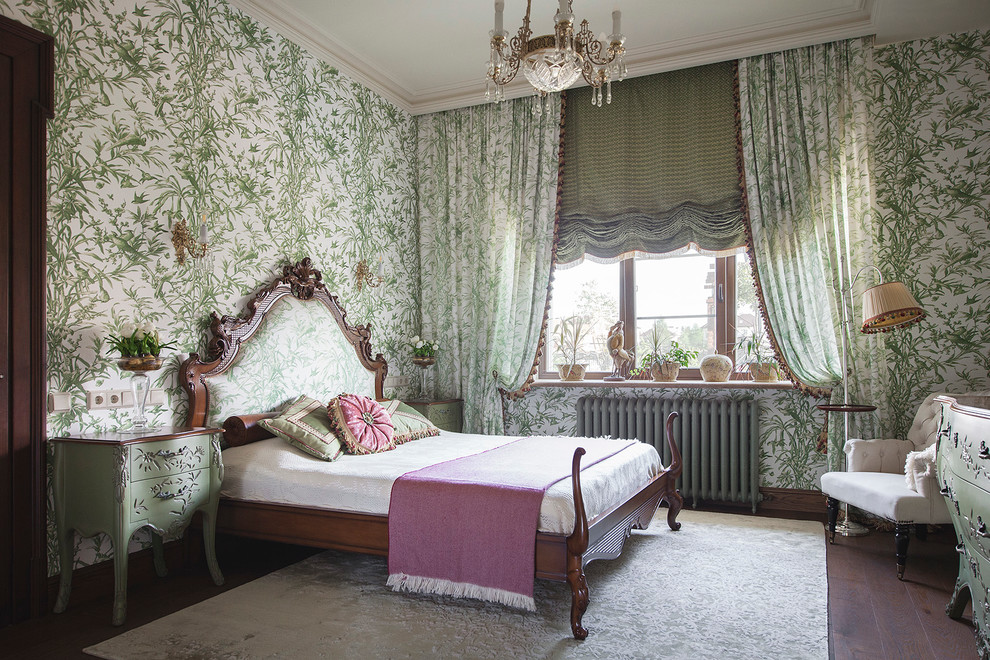 Photo of a traditional bedroom in Moscow with green walls and dark hardwood floors.