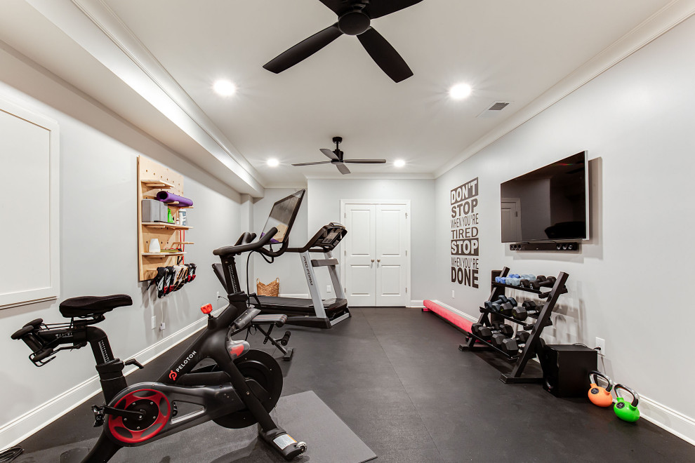 Example of a mid-sized black floor multiuse home gym design in Atlanta with gray walls