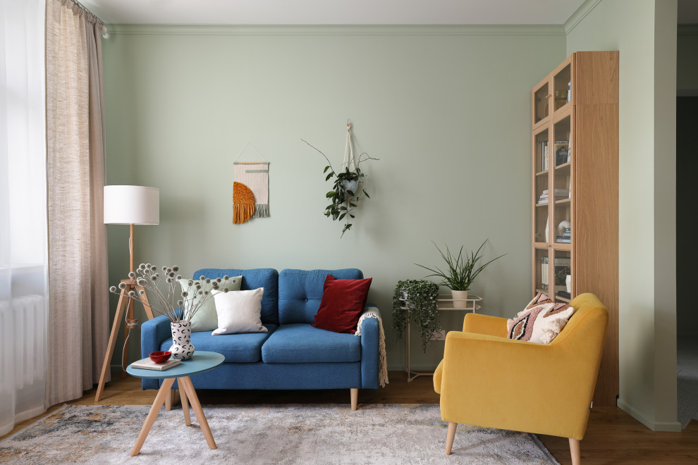 Design ideas for a medium sized scandinavian living room in Saint Petersburg with multi-coloured walls, medium hardwood flooring, no tv and brown floors.