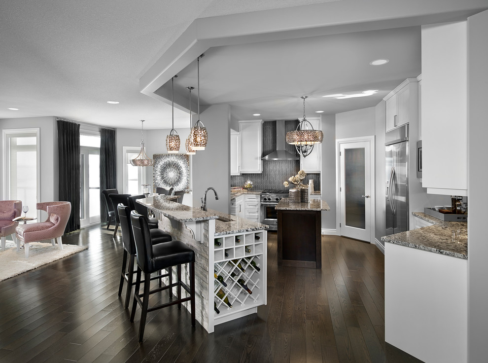 Inspiration for a transitional open plan kitchen in Edmonton with white cabinets, grey splashback, glass tile splashback, stainless steel appliances, an undermount sink and recessed-panel cabinets.