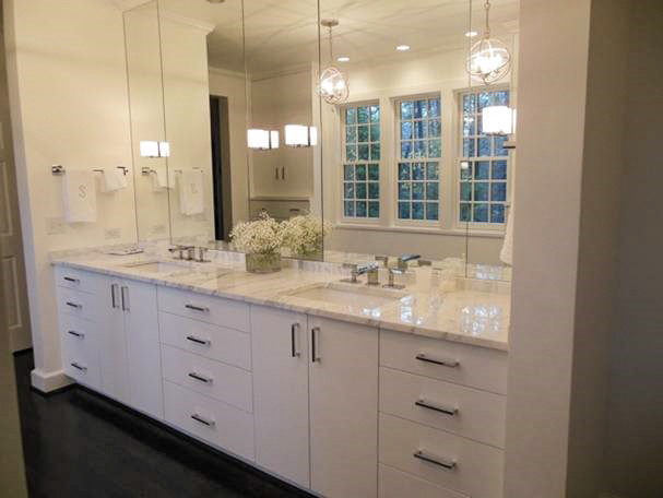 Large traditional master bathroom in Birmingham with an undermount sink, flat-panel cabinets, white cabinets, marble benchtops, a one-piece toilet, white tile, dark hardwood floors and white walls.