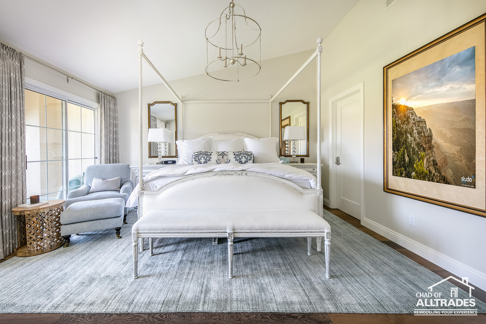 Mid-sized transitional guest bedroom in San Diego with white walls, medium hardwood floors and brown floor.