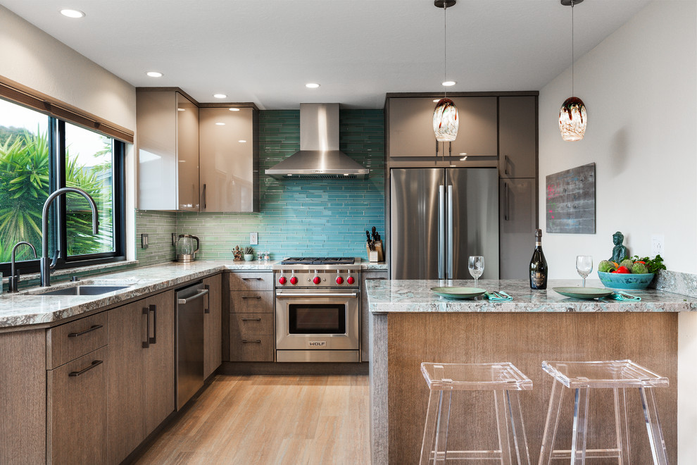 Inspiration for a mid-sized contemporary eat-in kitchen in Other with a single-bowl sink, flat-panel cabinets, quartz benchtops, green splashback, glass tile splashback, stainless steel appliances, bamboo floors, with island and turquoise benchtop.