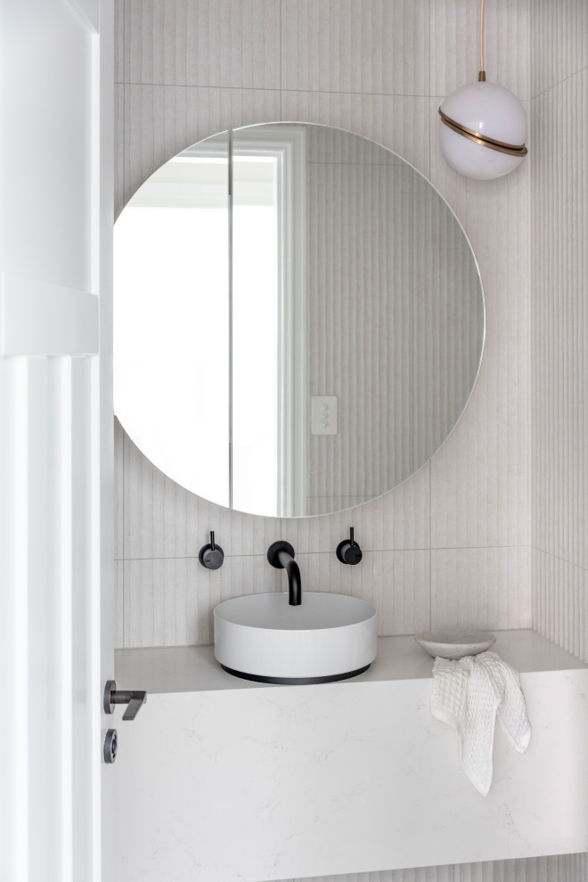 Inspiration for a small traditional powder room in Sydney with furniture-like cabinets, white cabinets, white tile, ceramic tile, porcelain floors, engineered quartz benchtops, grey floor, white benchtops and a floating vanity.