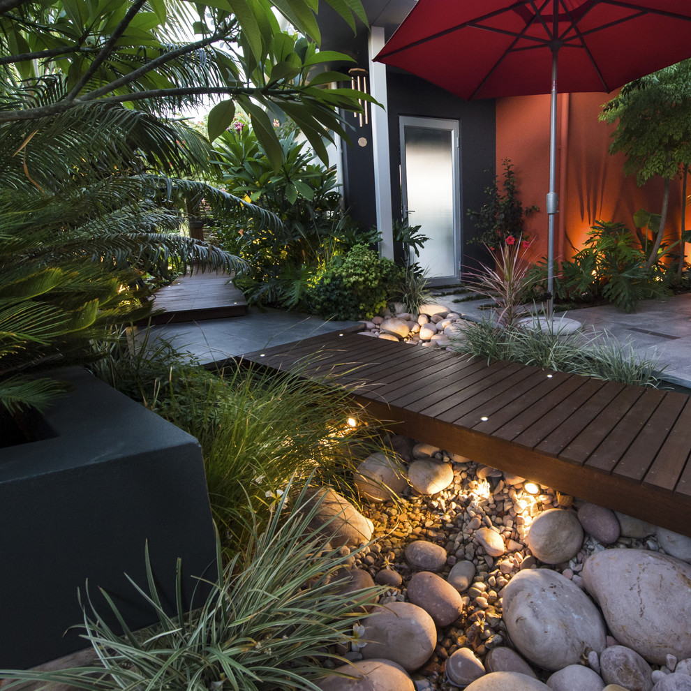 Photo of a small contemporary courtyard partial sun garden in Perth with a water feature and decking.