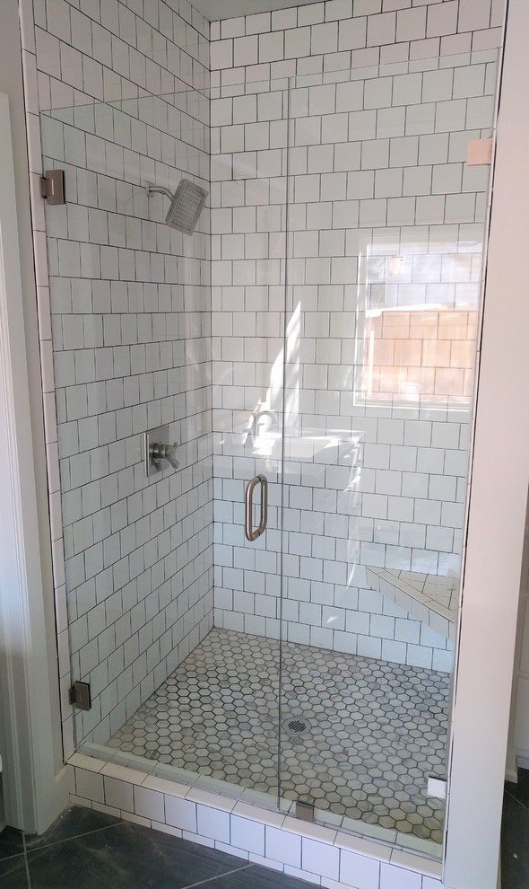 Bathroom - transitional bathroom idea with a hinged shower door