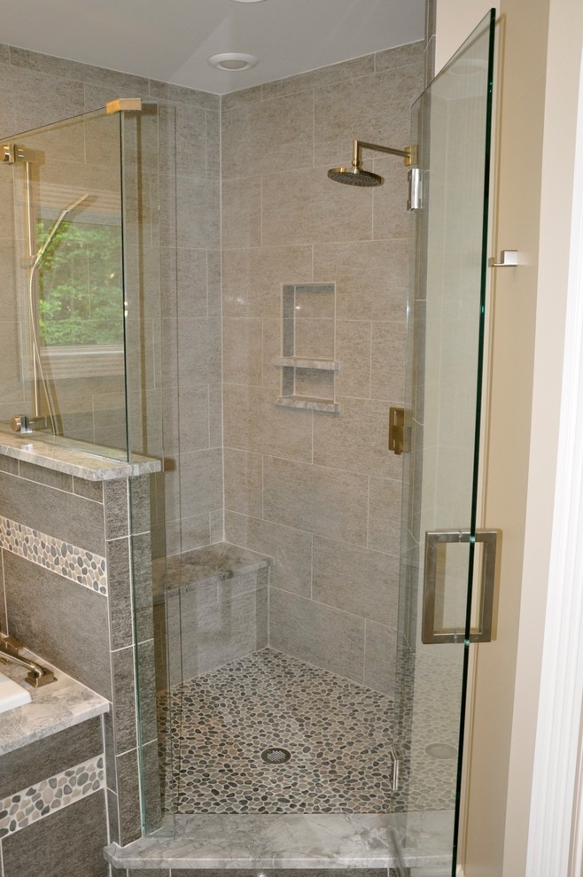 Example of a mid-sized transitional master gray tile and porcelain tile porcelain tile drop-in bathtub design in Cincinnati with granite countertops and beige walls