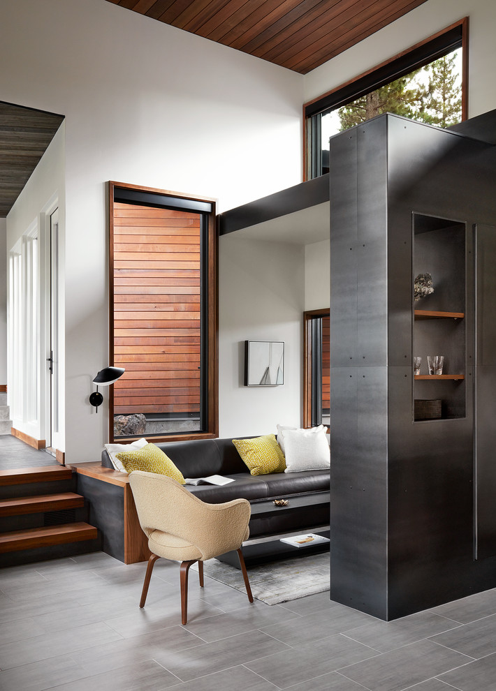 Mid-sized trendy open concept porcelain tile and gray floor family room photo in San Francisco with white walls, no tv and no fireplace
