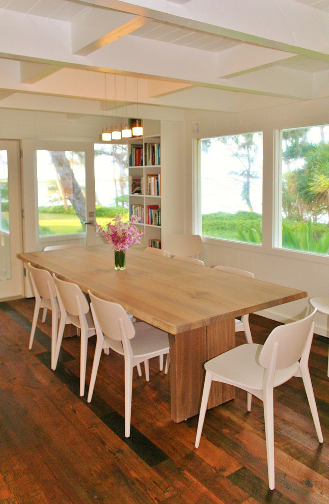 Design ideas for a mid-sized beach style open plan dining in Hawaii with white walls, dark hardwood floors and brown floor.