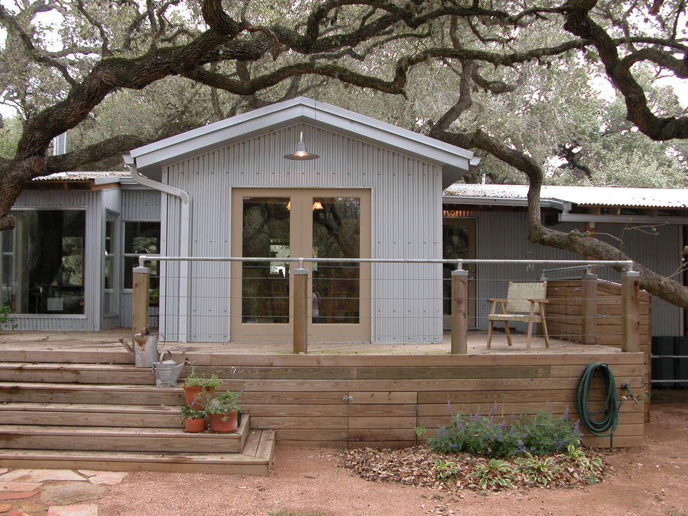 This is an example of an industrial exterior in Austin with metal siding and a gable roof.