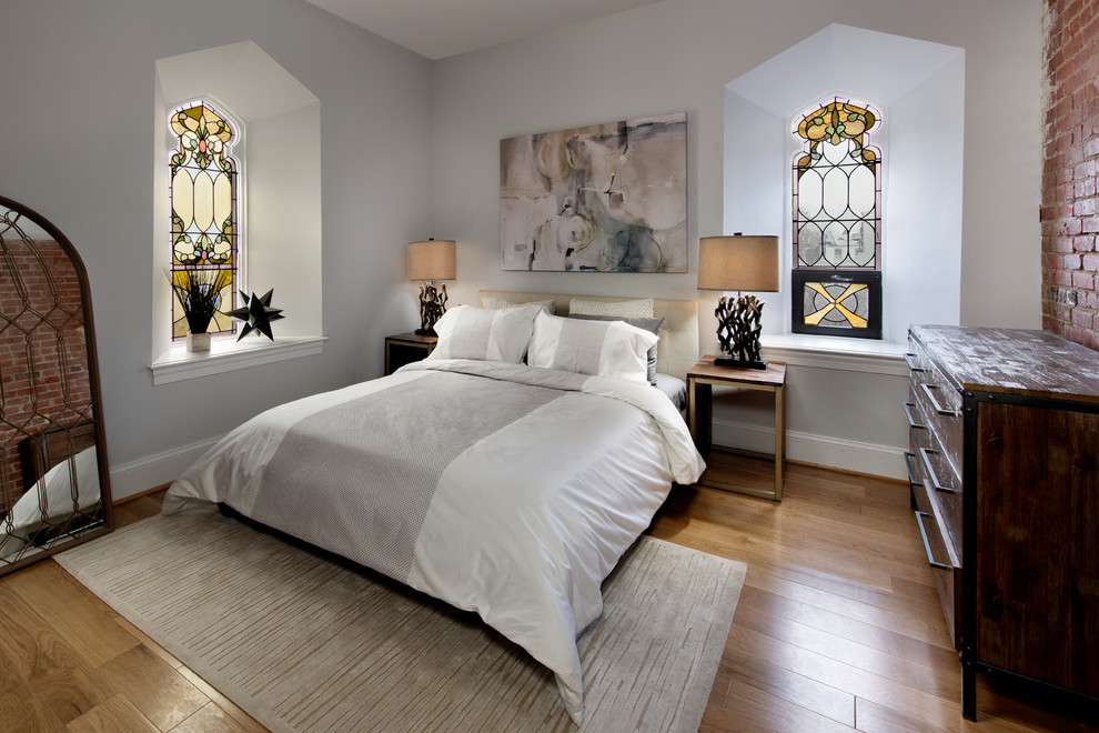 Inspiration for a traditional master bedroom in DC Metro with grey walls, light hardwood floors and beige floor.