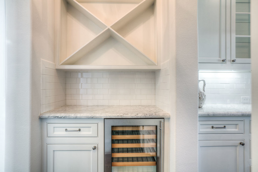 This is an example of a transitional kitchen in Houston.