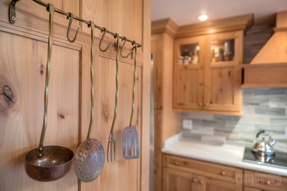 Eat-in kitchen photo in New York with marble countertops and no island