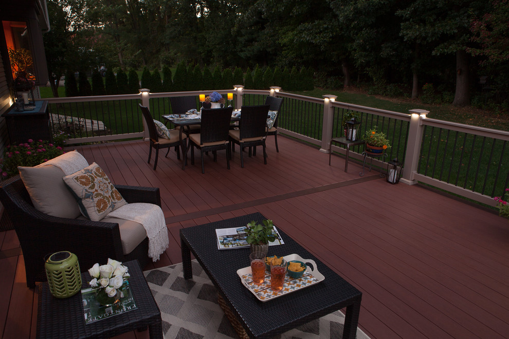 Inspiration for a large craftsman backyard deck remodel in Boston with a fire pit and no cover