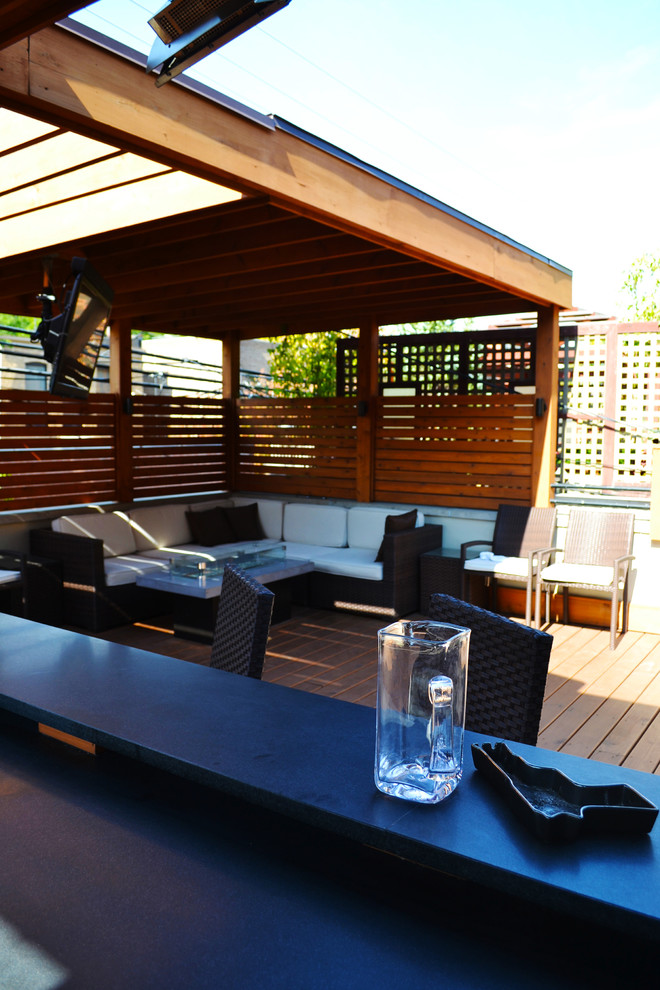Mid-sized transitional rooftop outdoor kitchen deck photo in Chicago with decking and a roof extension