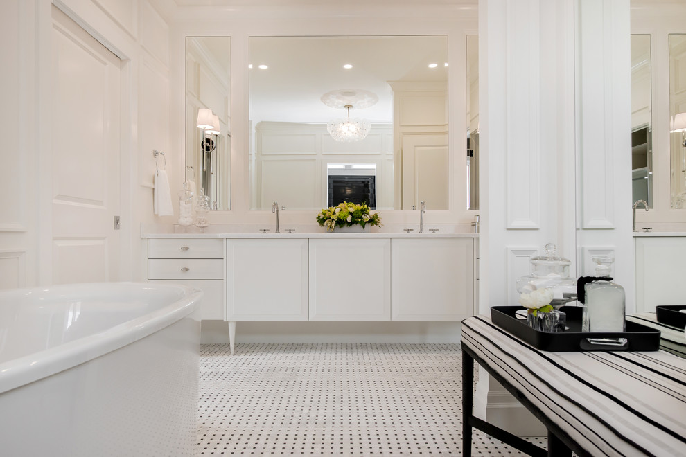 Freestanding bathtub - large transitional master multicolored tile and mosaic tile mosaic tile floor freestanding bathtub idea in Calgary with an undermount sink, raised-panel cabinets, white cabinets, quartz countertops, a one-piece toilet and white walls