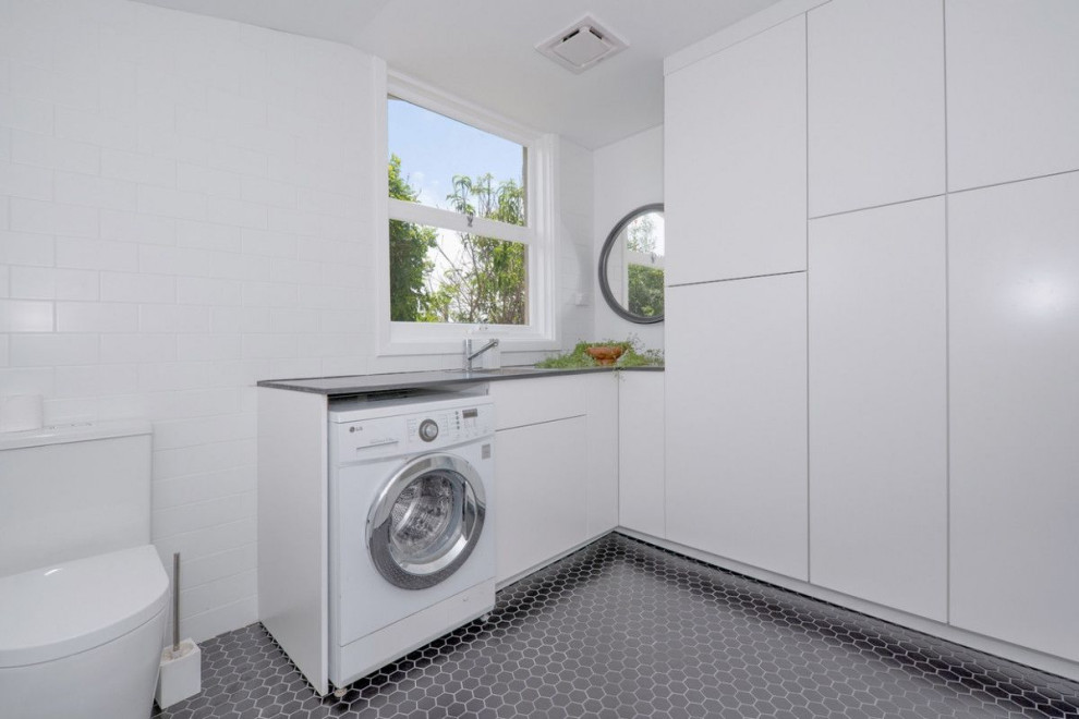 Design ideas for a contemporary laundry room in Perth.