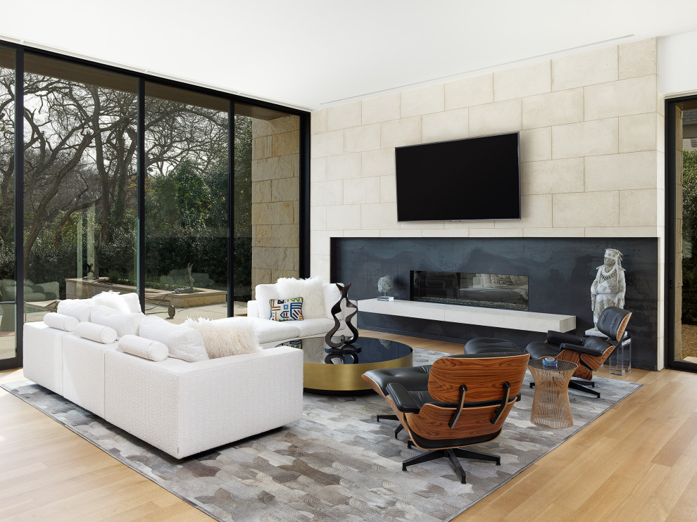 North Dallas - Mid-sized trendy open concept light wood floor and beige floor living room photo in Dallas with white walls, a ribbon fireplace, a stone fireplace and a wall-mounted tv