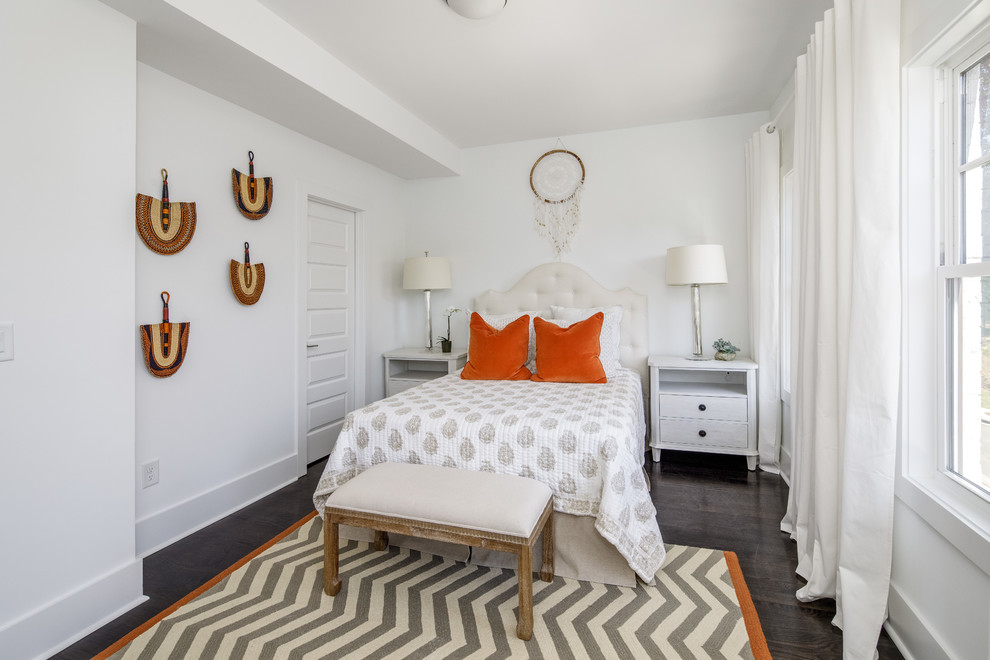 Photo of a transitional bedroom in Atlanta with white walls, dark hardwood floors and black floor.