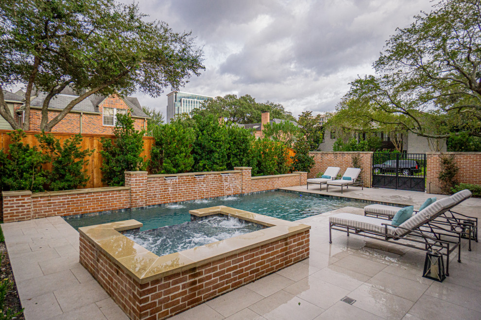 Inspiration for a mid-sized traditional backyard rectangular pool in Houston.