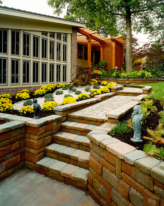 Inspiration for a mid-sized transitional full sun backyard stone outdoor basketball/tennis/multi-game court.