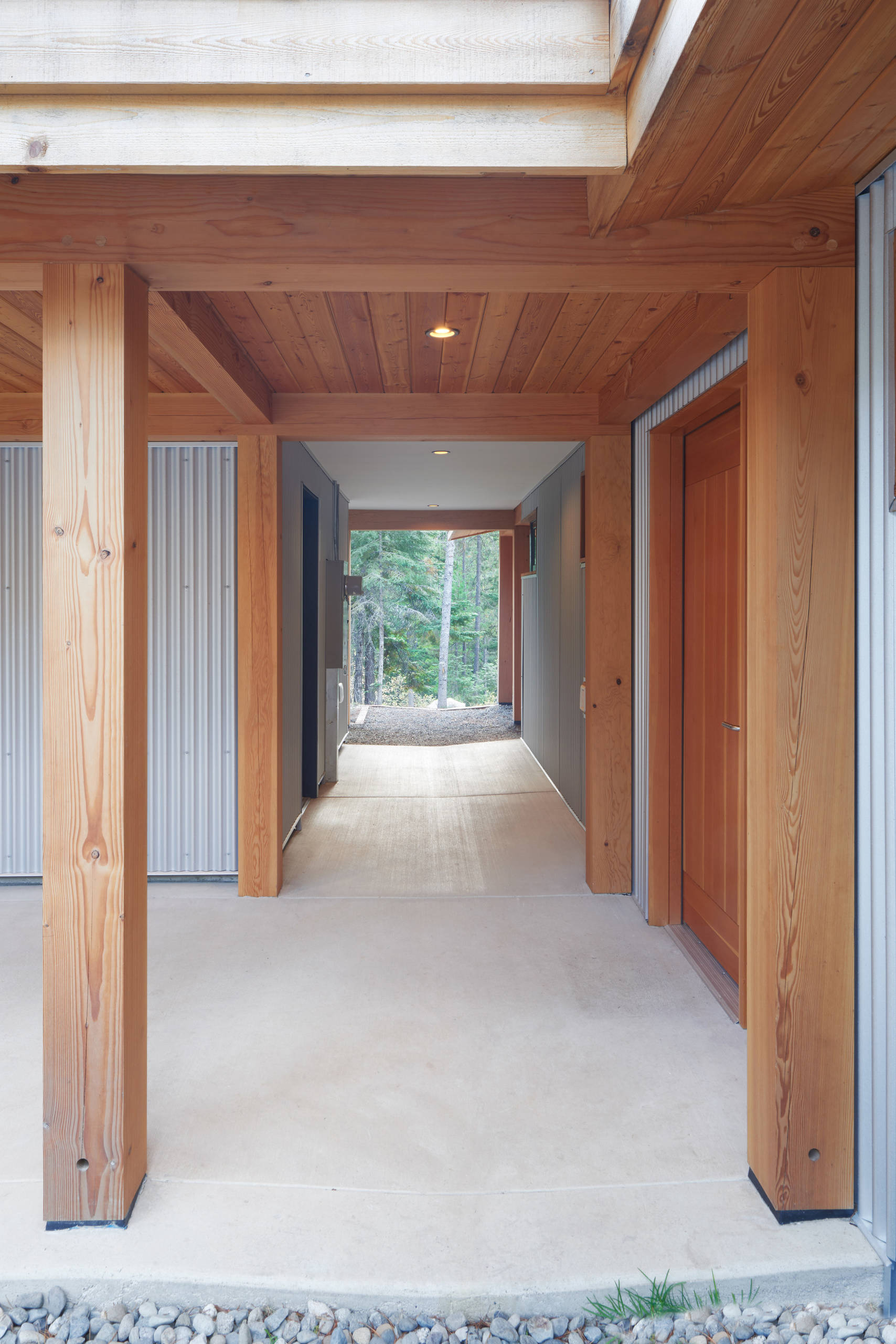 The breezeway is perpendicular to the colonnade with gear room on the left.