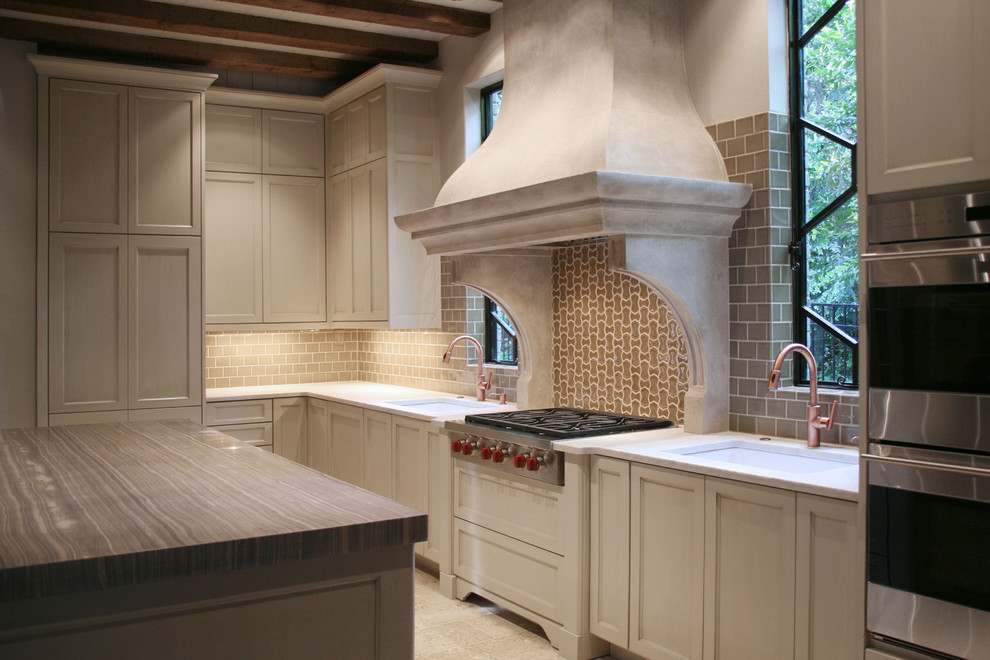 Design ideas for a traditional kitchen in Atlanta with quartzite benchtops, beige splashback, mosaic tile splashback and with island.