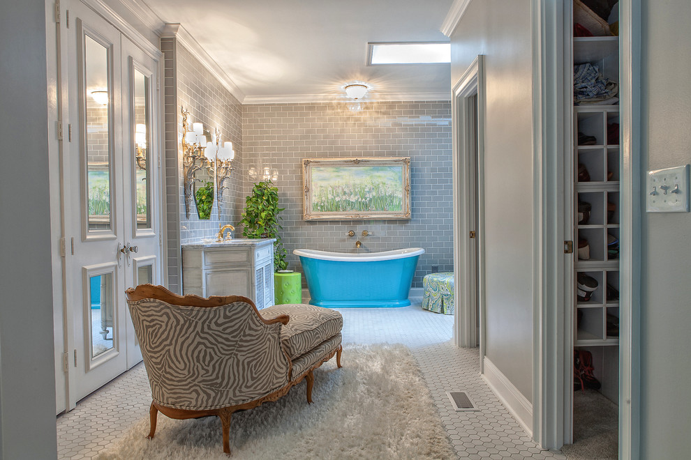 Design ideas for a mid-sized traditional master bathroom in Atlanta with subway tile, shaker cabinets, distressed cabinets, a freestanding tub, gray tile, grey walls, porcelain floors, an undermount sink, a corner shower and marble benchtops.