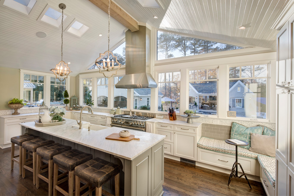 Inspiration for a traditional l-shaped kitchen in Other with shaker cabinets, marble benchtops, stainless steel appliances, with island, brown floor, white cabinets, window splashback and dark hardwood floors.