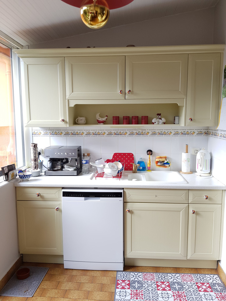 Photo of a medium sized rural galley enclosed kitchen in Other with a submerged sink, flat-panel cabinets, green cabinets, white splashback, ceramic splashback, white appliances, ceramic flooring, no island, brown floors, white worktops and a timber clad ceiling.