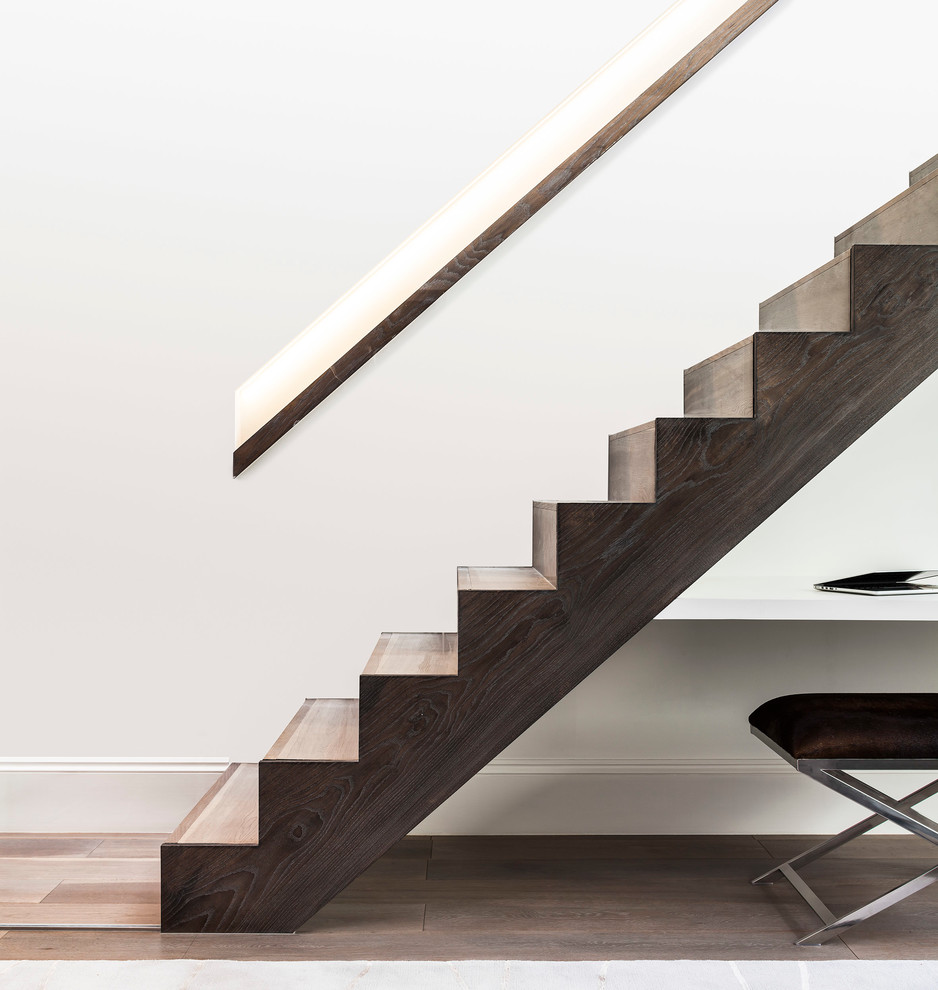 Mid-sized contemporary wood straight staircase in London with wood risers.