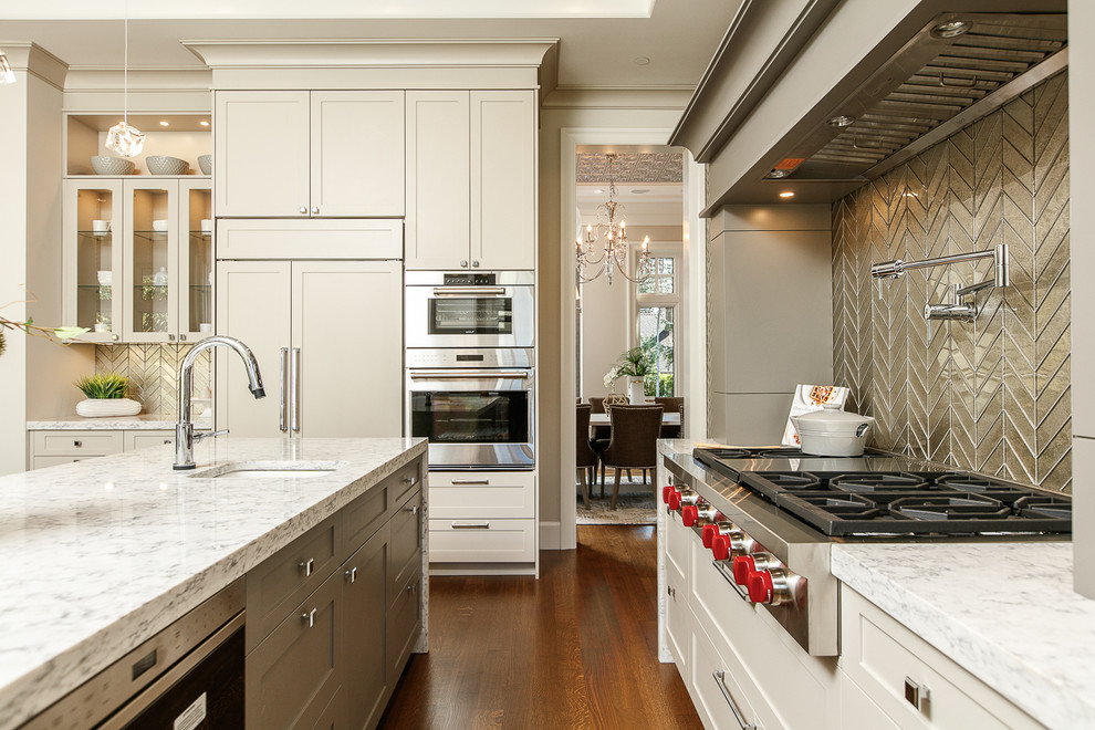 Inspiration for a transitional separate kitchen in Vancouver with an undermount sink, shaker cabinets, beige cabinets, metallic splashback, metal splashback, panelled appliances, medium hardwood floors and with island.
