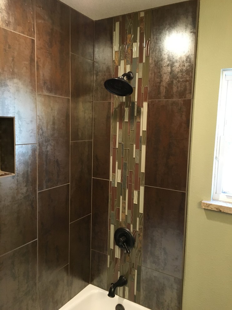 Photo of a mid-sized transitional kids bathroom in Sacramento with dark wood cabinets, a one-piece toilet, brown tile, stone slab, green walls, porcelain floors and granite benchtops.