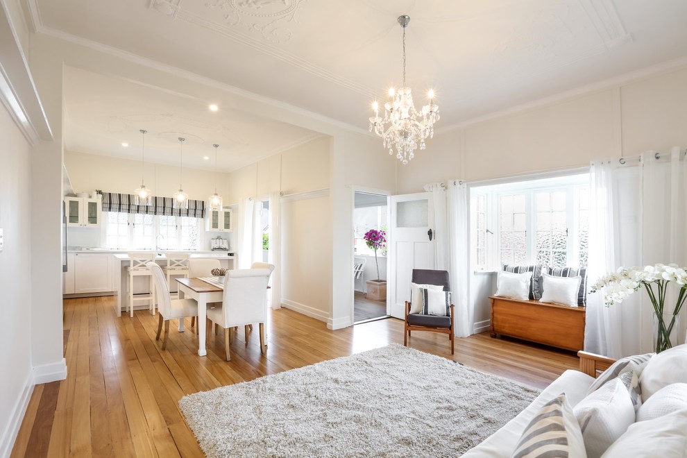 Mid-sized scandinavian formal open concept living room in Brisbane with light hardwood floors.