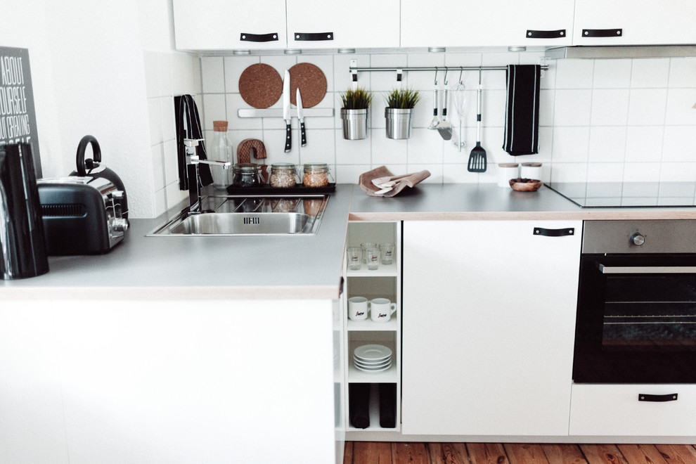 kitchen in white, black, grey and cork